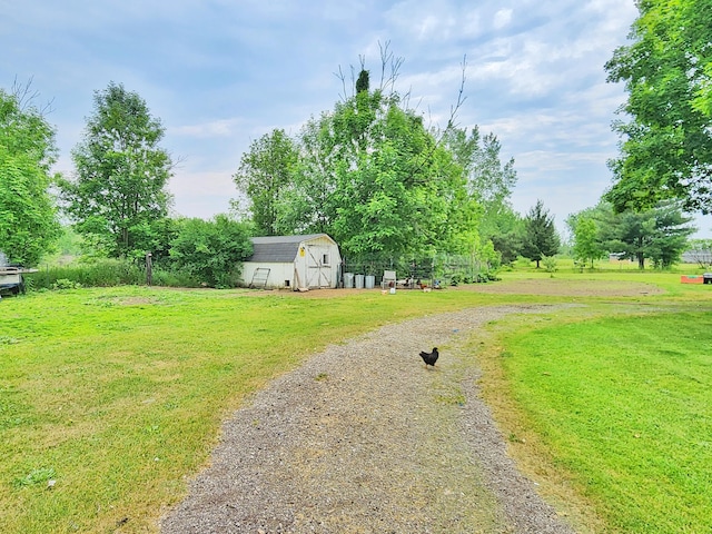 350 S Catalpa Ave, White Cloud, MI 49349 - view of green lawn with a storage shed