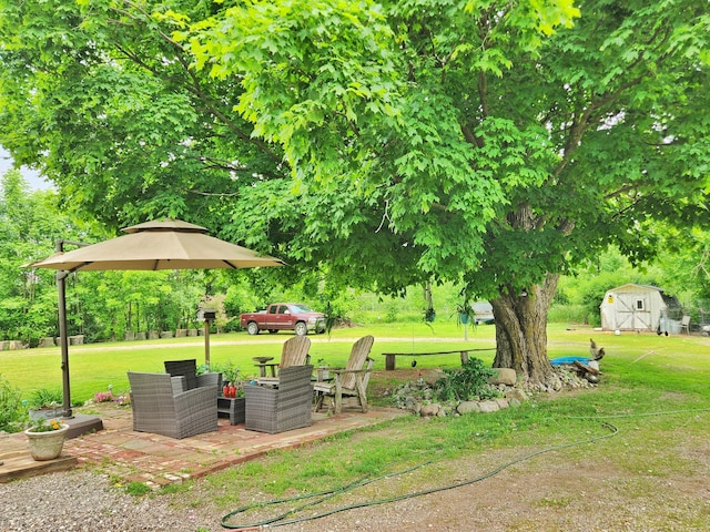 350 S Catalpa Ave, White Cloud, MI 49349 - view of green lawn featuring a shed and view of scattered trees