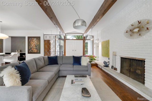 6895 Cedarbrook Dr, Bloomfield Hills, MI 48301 - living room featuring beamed ceiling, wood finished floors, and a fireplace