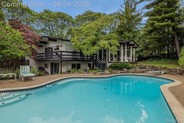 6895 Cedarbrook Dr, Bloomfield Hills, MI 48301 - outdoor pool with a wooden deck, a diving board, and stairs