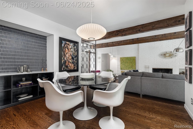 6895 Cedarbrook Dr, Bloomfield Hills, MI 48301 - dining area with dark wood-style floors and a brick fireplace