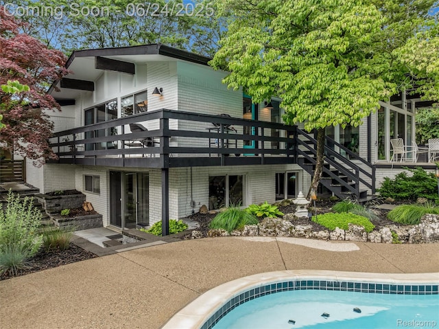 6895 Cedarbrook Dr, Bloomfield Hills, MI 48301 - back of house with a deck and stairway