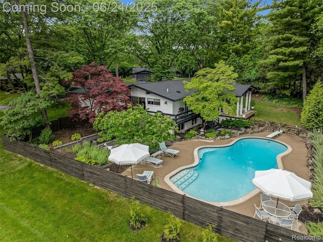 6895 Cedarbrook Dr, Bloomfield Hills, MI 48301 - view of swimming pool with a patio area, a diving board, and view of scattered trees