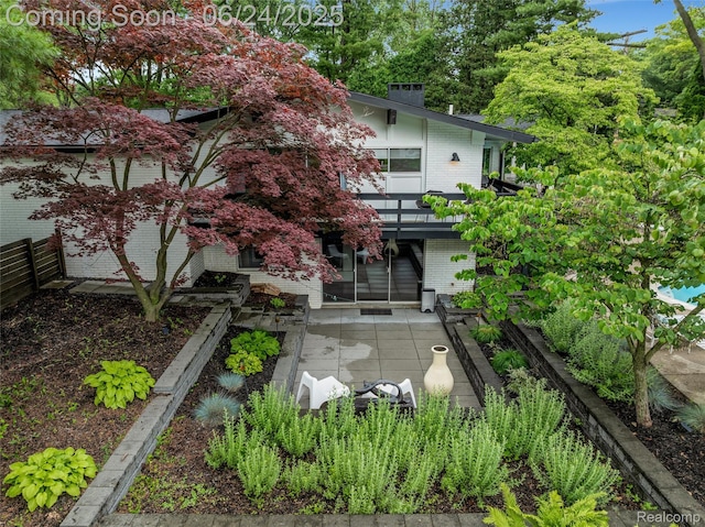 6895 Cedarbrook Dr, Bloomfield Hills, MI 48301 - back of property with a patio and brick siding