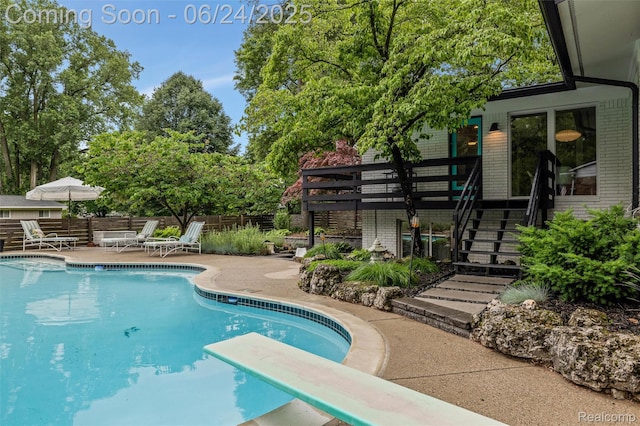 6895 Cedarbrook Dr, Bloomfield Hills, MI 48301 - view of pool featuring stairs, a patio area, and a diving board