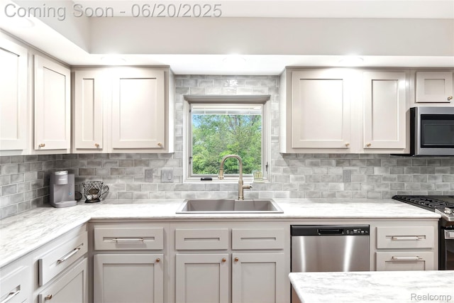 459 N Elms Rd, Flushing, MI 48433 - kitchen featuring stainless steel appliances and decorative backsplash