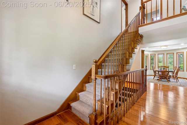 459 N Elms Rd, Flushing, MI 48433 - stairway with a towering ceiling and hardwood / wood-style floors