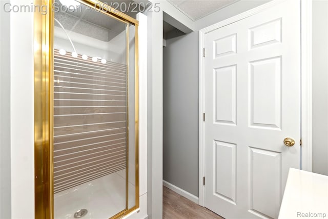 459 N Elms Rd, Flushing, MI 48433 - bathroom featuring a stall shower and wood finished floors