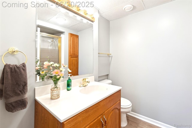 459 N Elms Rd, Flushing, MI 48433 - full bath with vanity, a shower with door, and wood finished floors