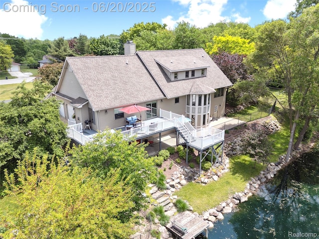 459 N Elms Rd, Flushing, MI 48433 - back of property featuring stairway, a wooden deck, a shingled roof, and a chimney