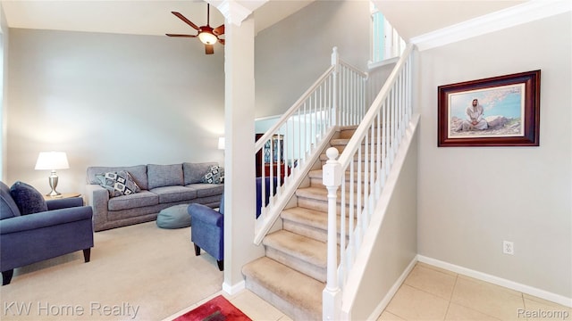 2836 Otter Ct, Wixom, MI 48393 - stairs featuring a ceiling fan and tile patterned flooring