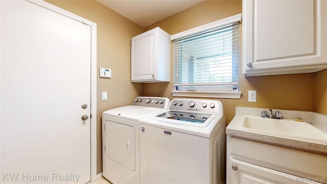 2836 Otter Ct, Wixom, MI 48393 - laundry area with cabinet space and independent washer and dryer