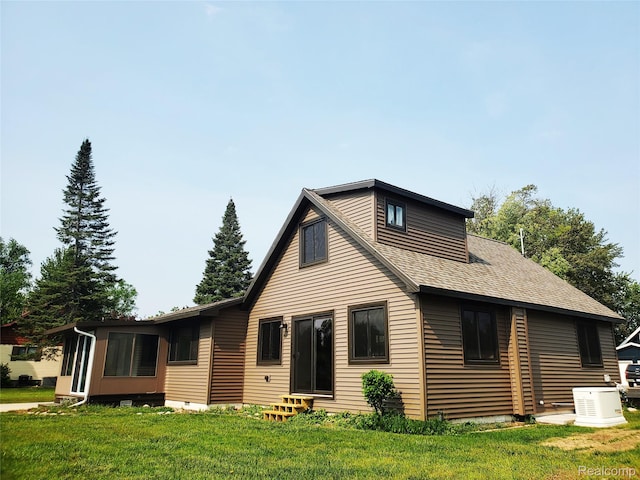 115 Choctaw Trl, Prudenville, MI 48651 - back of property featuring entry steps, a yard, and a shingled roof