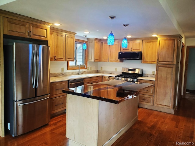 115 Choctaw Trl, Prudenville, MI 48651 - kitchen with stainless steel appliances, dark wood-style floors, decorative light fixtures, a center island, and recessed lighting