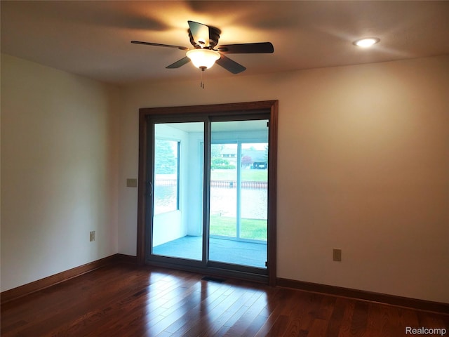 115 Choctaw Trl, Prudenville, MI 48651 - spare room with dark wood-style flooring, a ceiling fan, and recessed lighting