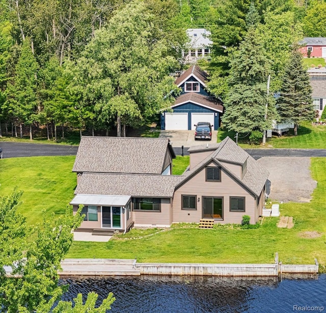 115 Choctaw Trl, Prudenville, MI 48651 - back of house featuring a water view, a detached garage, and a shingled roof