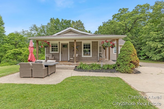 1495 Yeckley Rd, Hastings, MI 49058 - view of front of home featuring a front yard and a porch