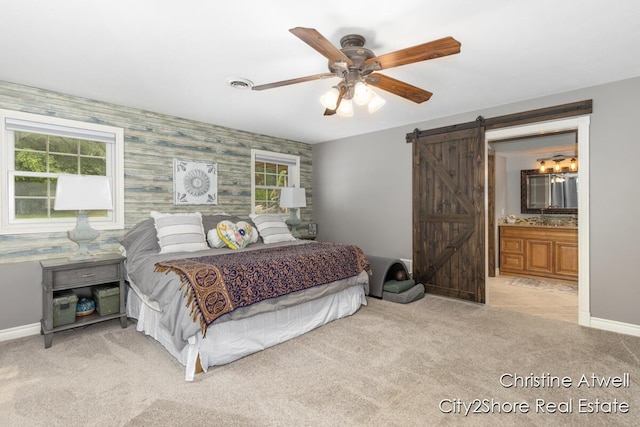 1495 Yeckley Rd, Hastings, MI 49058 - carpeted bedroom featuring a barn door, multiple windows, an accent wall, wallpapered walls, and ceiling fan
