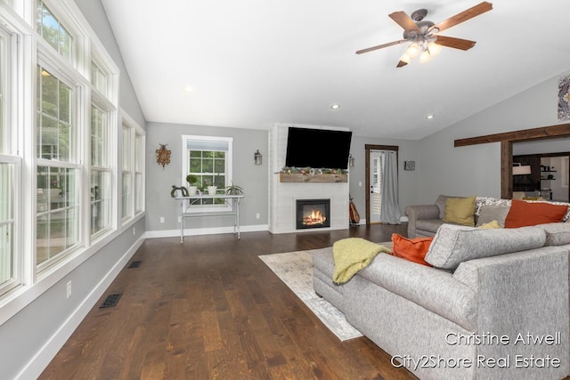 1495 Yeckley Rd, Hastings, MI 49058 - living room with lofted ceiling, dark wood-style flooring, a large fireplace, a ceiling fan, and recessed lighting