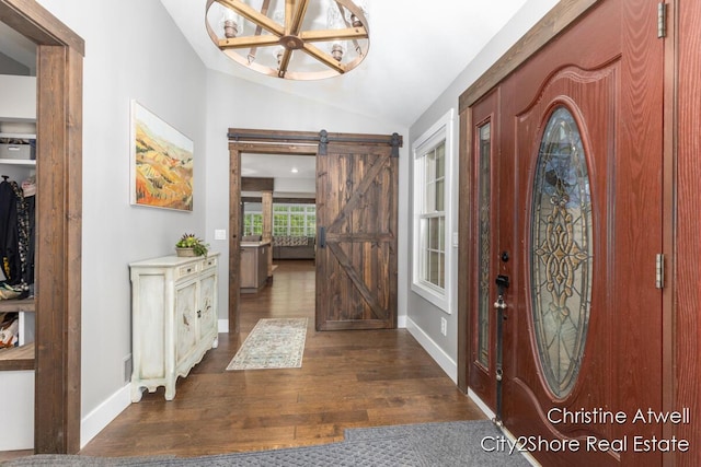 1495 Yeckley Rd, Hastings, MI 49058 - foyer entrance with dark wood-style flooring, vaulted ceiling, a chandelier, and a barn door