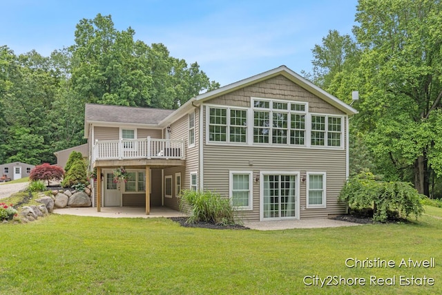 1495 Yeckley Rd, Hastings, MI 49058 - back of property featuring a patio, a lawn, and a deck