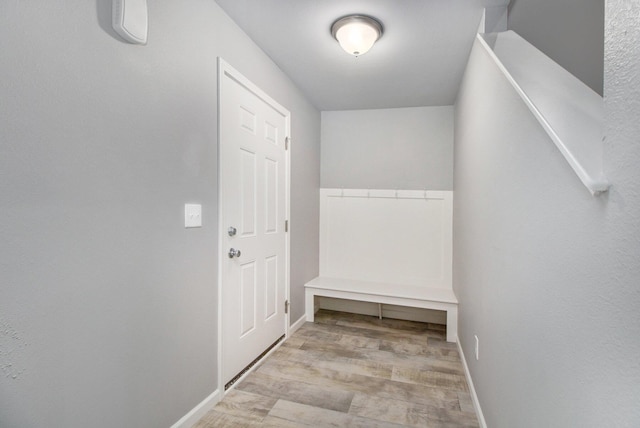 7216 Heartwood Ct, Portage, MI 49002 - doorway to outside featuring wood finished floors and baseboards