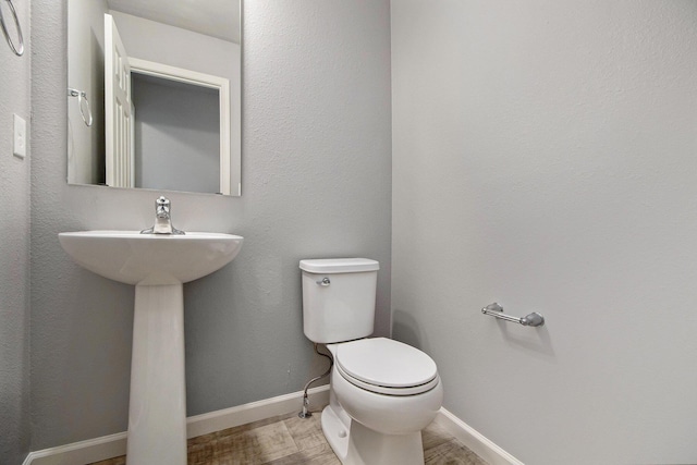 7216 Heartwood Ct, Portage, MI 49002 - bathroom with toilet and wood finished floors
