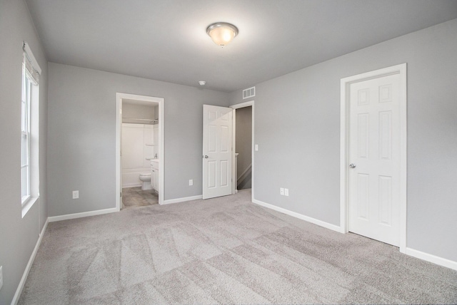 7216 Heartwood Ct, Portage, MI 49002 - unfurnished bedroom featuring carpet and ensuite bath