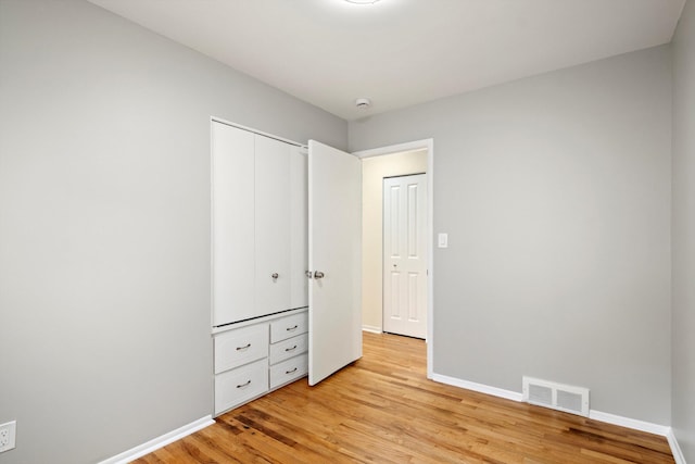 7710 Pelham Rd, Taylor, MI 48180 - unfurnished bedroom featuring light wood-style floors and a closet