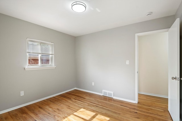 7710 Pelham Rd, Taylor, MI 48180 - empty room with light wood-style flooring and a smoke detector