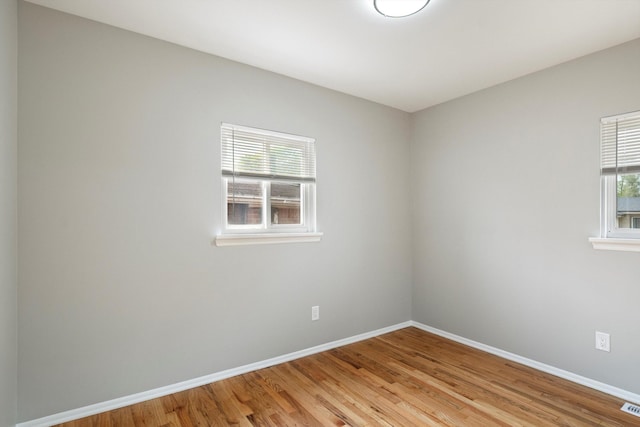 7710 Pelham Rd, Taylor, MI 48180 - empty room with baseboards and light wood-type flooring