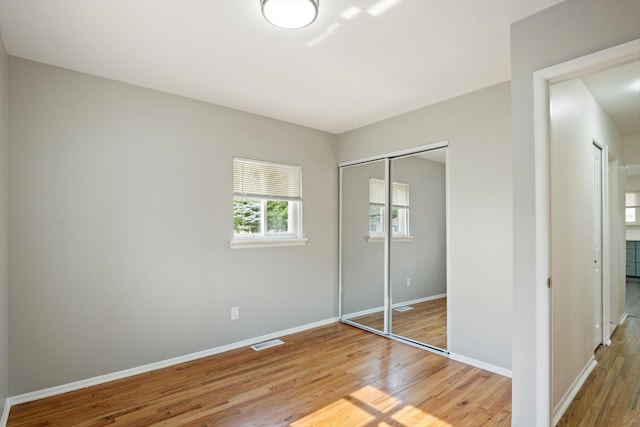 7710 Pelham Rd, Taylor, MI 48180 - unfurnished bedroom featuring light wood-style flooring and a closet