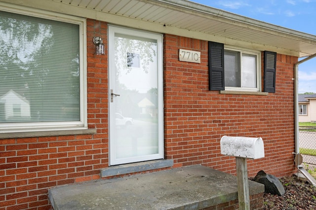 7710 Pelham Rd, Taylor, MI 48180 - doorway to property featuring brick siding