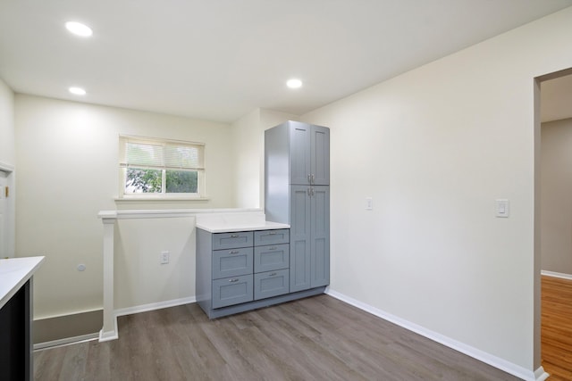 7710 Pelham Rd, Taylor, MI 48180 - laundry room with wood finished floors and recessed lighting