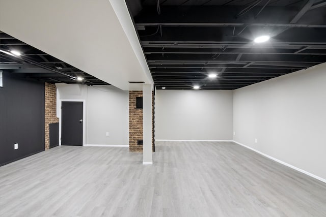 7710 Pelham Rd, Taylor, MI 48180 - finished below grade area featuring wood finished floors and baseboards