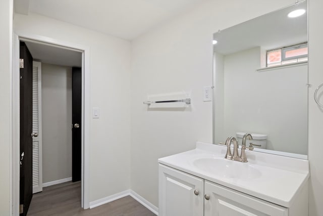 7710 Pelham Rd, Taylor, MI 48180 - bathroom featuring wood finished floors and vanity