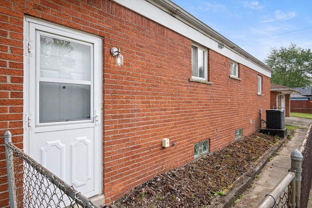 7710 Pelham Rd, Taylor, MI 48180 - view of property exterior featuring brick siding and a central AC unit