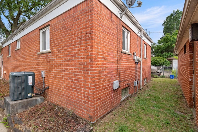 7710 Pelham Rd, Taylor, MI 48180 - view of side of home featuring a central air condition unit and brick siding