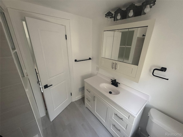 910 Spence St, Southfield, MI 48340 - bathroom with vanity and wood finished floors