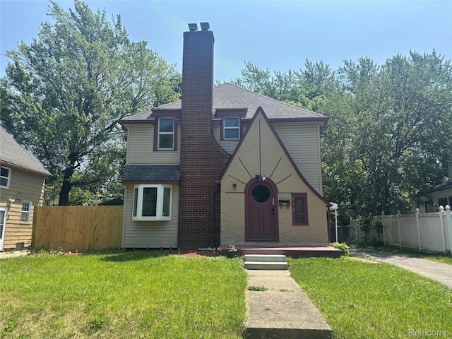 910 Spence St, Southfield, MI 48340 - english style home featuring a chimney and a shingled roof