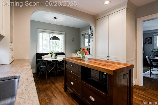 55 Oakdale Blvd, Pleasant Ridge, MI 48069 - kitchen featuring butcher block countertops, dark wood-style floors, arched walkways, black microwave, and recessed lighting