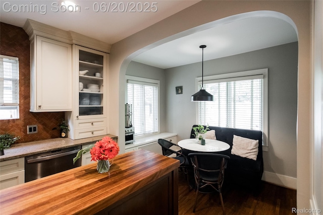 55 Oakdale Blvd, Pleasant Ridge, MI 48069 - dining space with arched walkways and dark wood-type flooring