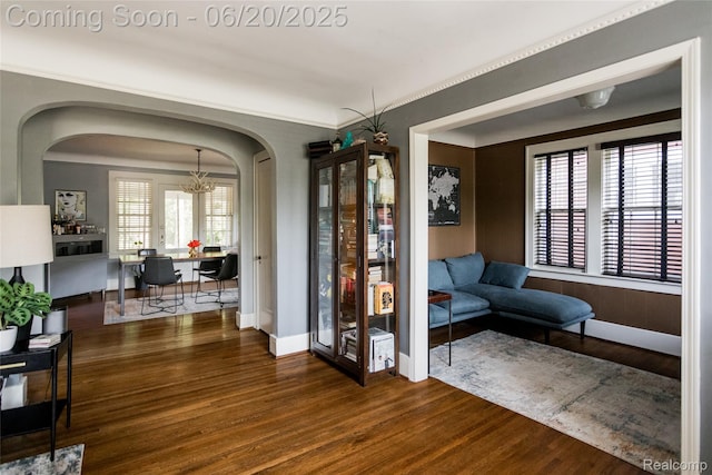 55 Oakdale Blvd, Pleasant Ridge, MI 48069 - entryway featuring arched walkways, wood finished floors, and a chandelier