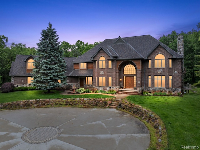 429 Hawk High Hill Rd, Metamora, MI 48455 - view of front of home with a chimney, a front lawn, and brick siding