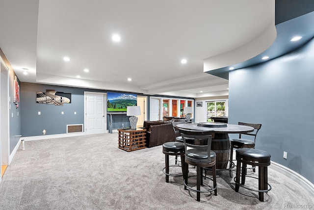 429 Hawk High Hill Rd, Metamora, MI 48455 - dining space featuring recessed lighting, light colored carpet, and a tray ceiling