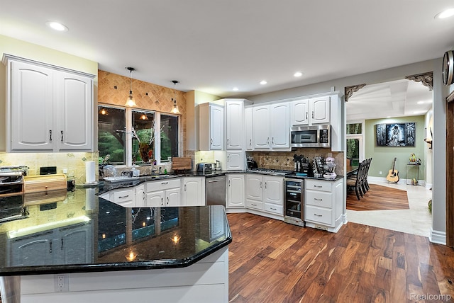 429 Hawk High Hill Rd, Metamora, MI 48455 - kitchen featuring wine cooler, white cabinets, appliances with stainless steel finishes, tasteful backsplash, and dark stone countertops