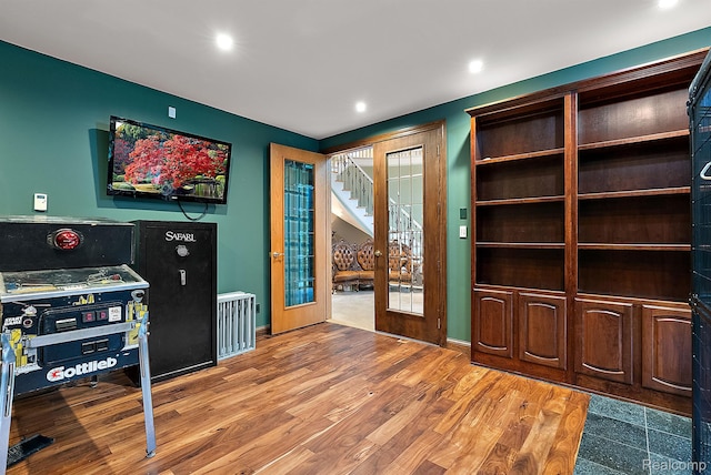 429 Hawk High Hill Rd, Metamora, MI 48455 - unfurnished office with wood finished floors, french doors, and recessed lighting