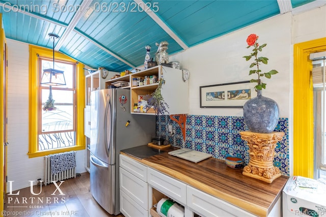 1200 Porter St, Detroit, MI 48226 - kitchen with radiator heating unit, wood counters, vaulted ceiling, white cabinetry, and open shelves