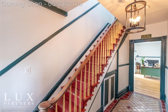 1200 Porter St, Detroit, MI 48226 - stairway with a chandelier and tile patterned floors
