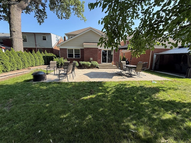 23540 Wilson Ave, Dearborn, MI 48128 - back of property featuring brick siding, a patio area, a gazebo, entry steps, and a yard